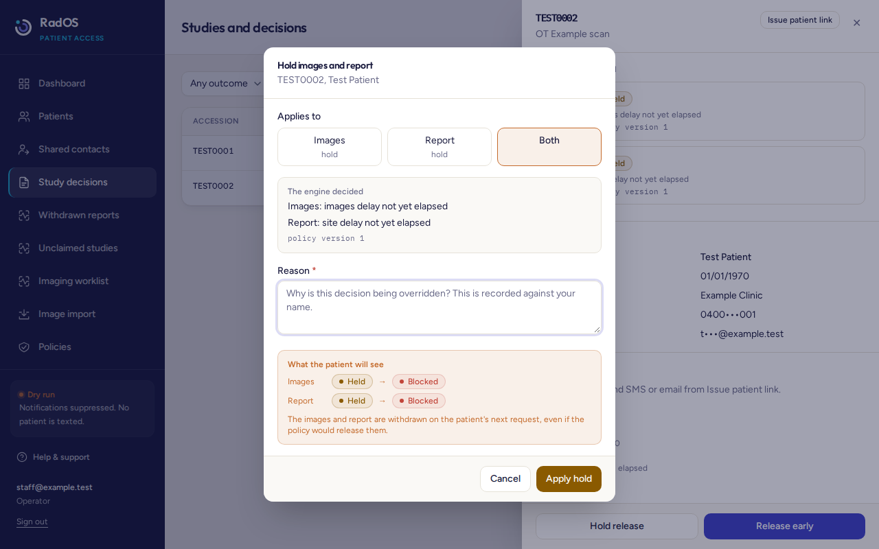 Hold dialog for TEST0002 with Both selected. The patient outcome would change to blocked.